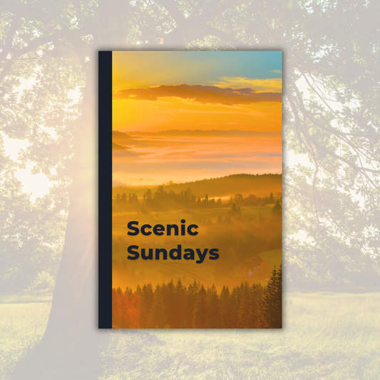 Weekly_Day_Journals_Scenic_Sundays_Sunlight_front_cover; golden sunrise over a tree-lined hilly scene with midnight blue spine and text; a faded image of a tree in a field in the background