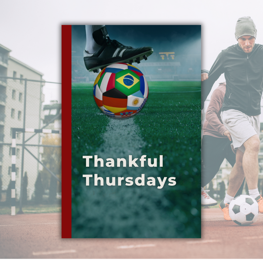 Weekly Day Journals Thankful Thursdays (front cover), foot in soccer cleat set on soccer ball that has international country flags on ball panels on a soccer field, with a red spine

